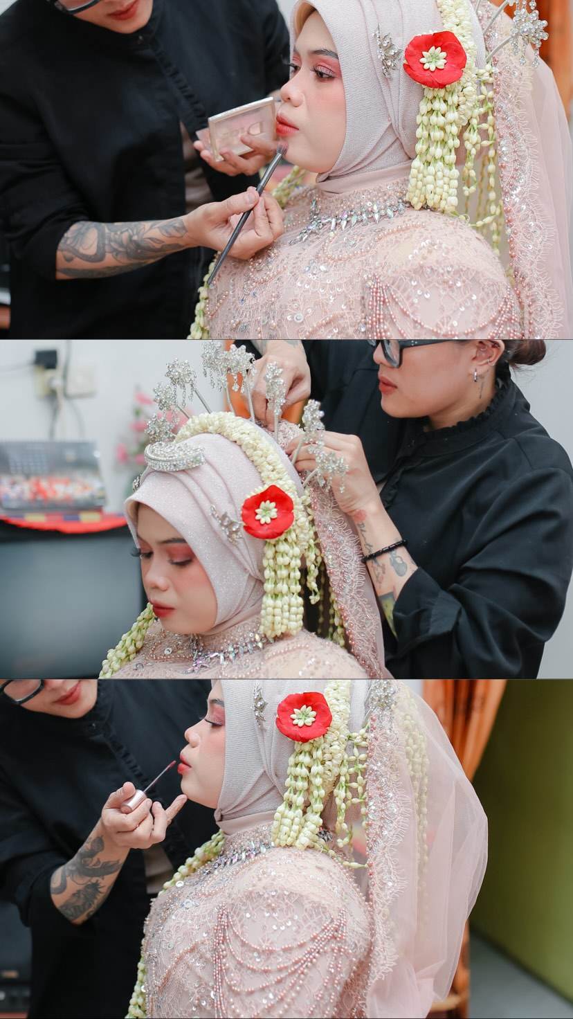 Ayuradhanti applying makeup to a client
